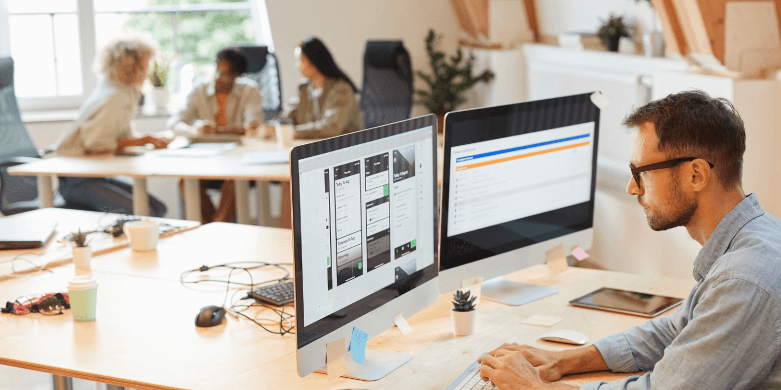 People working in an office using a Digital Adoption Platform